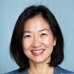 Dr. Emily Chen, co-founder of AuraWell and Integrative Medicine MD, smiling confidently.